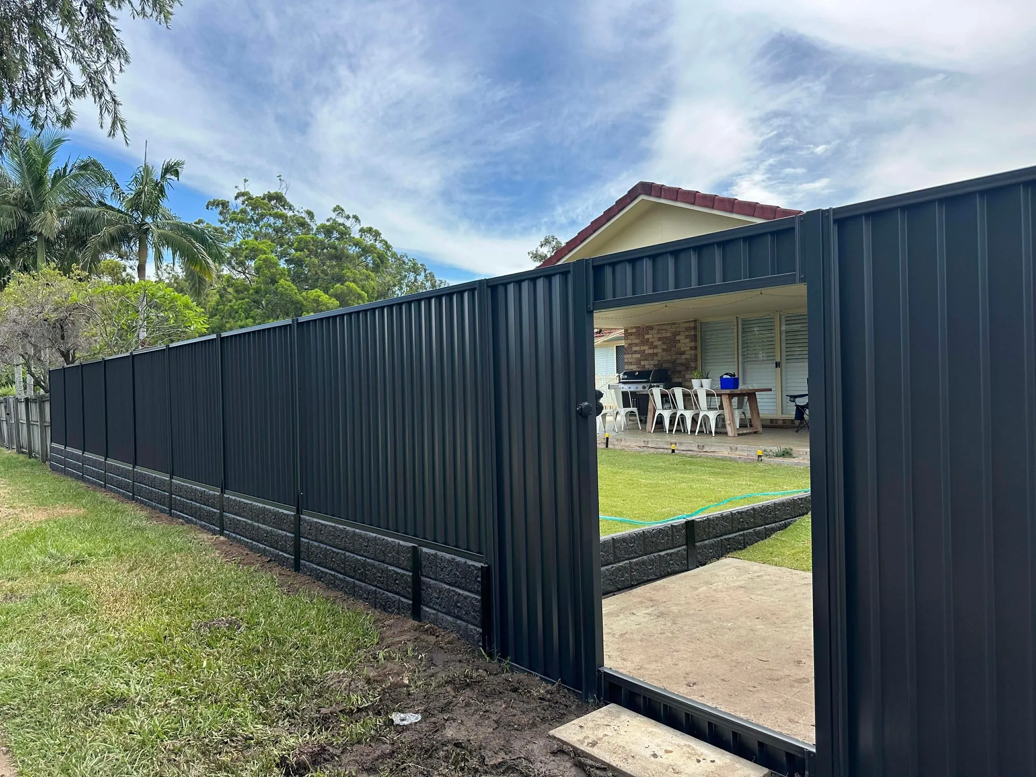 Colorbond fence and gate above a retaining wall