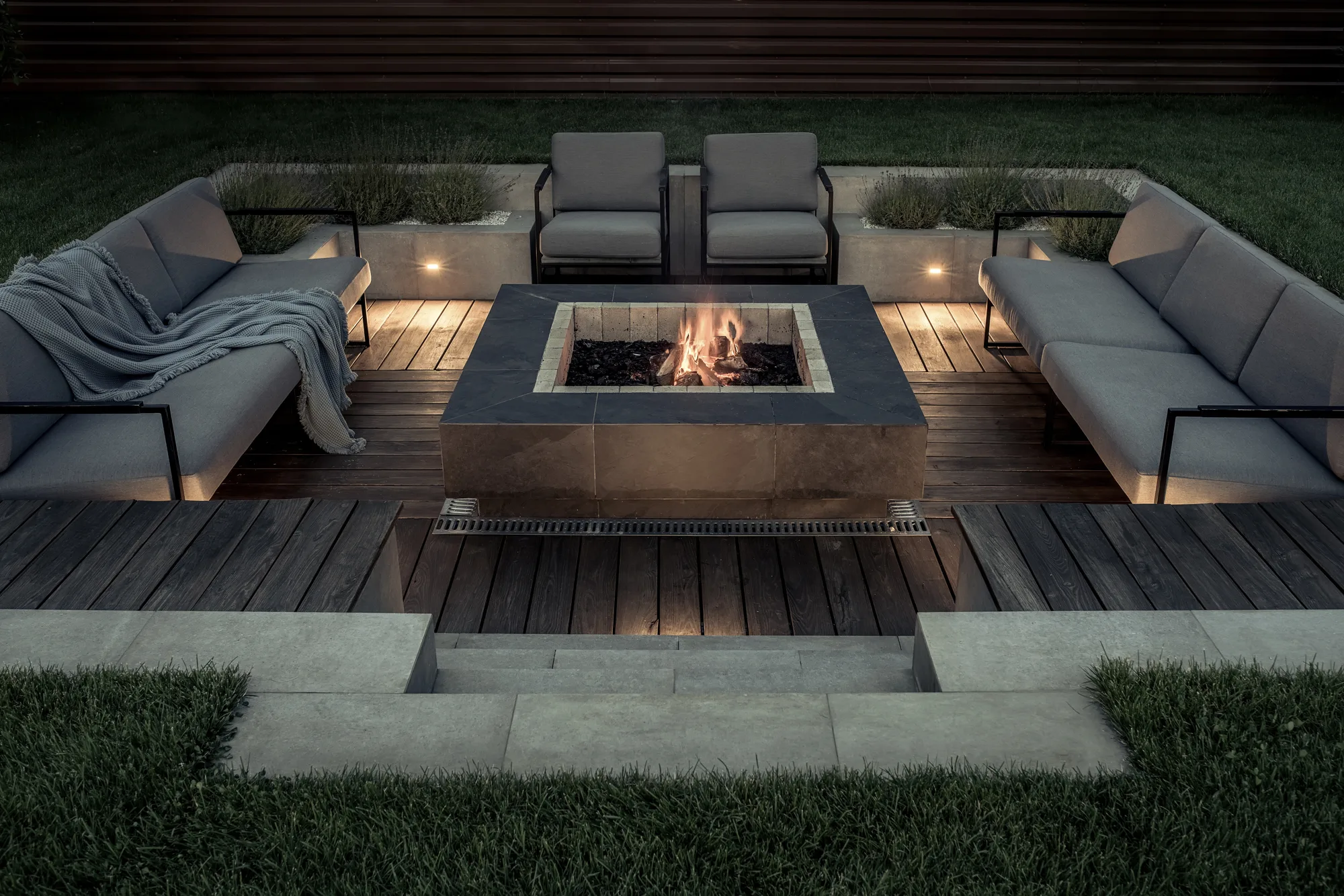 Sunken fire pit lounge with built-in seating