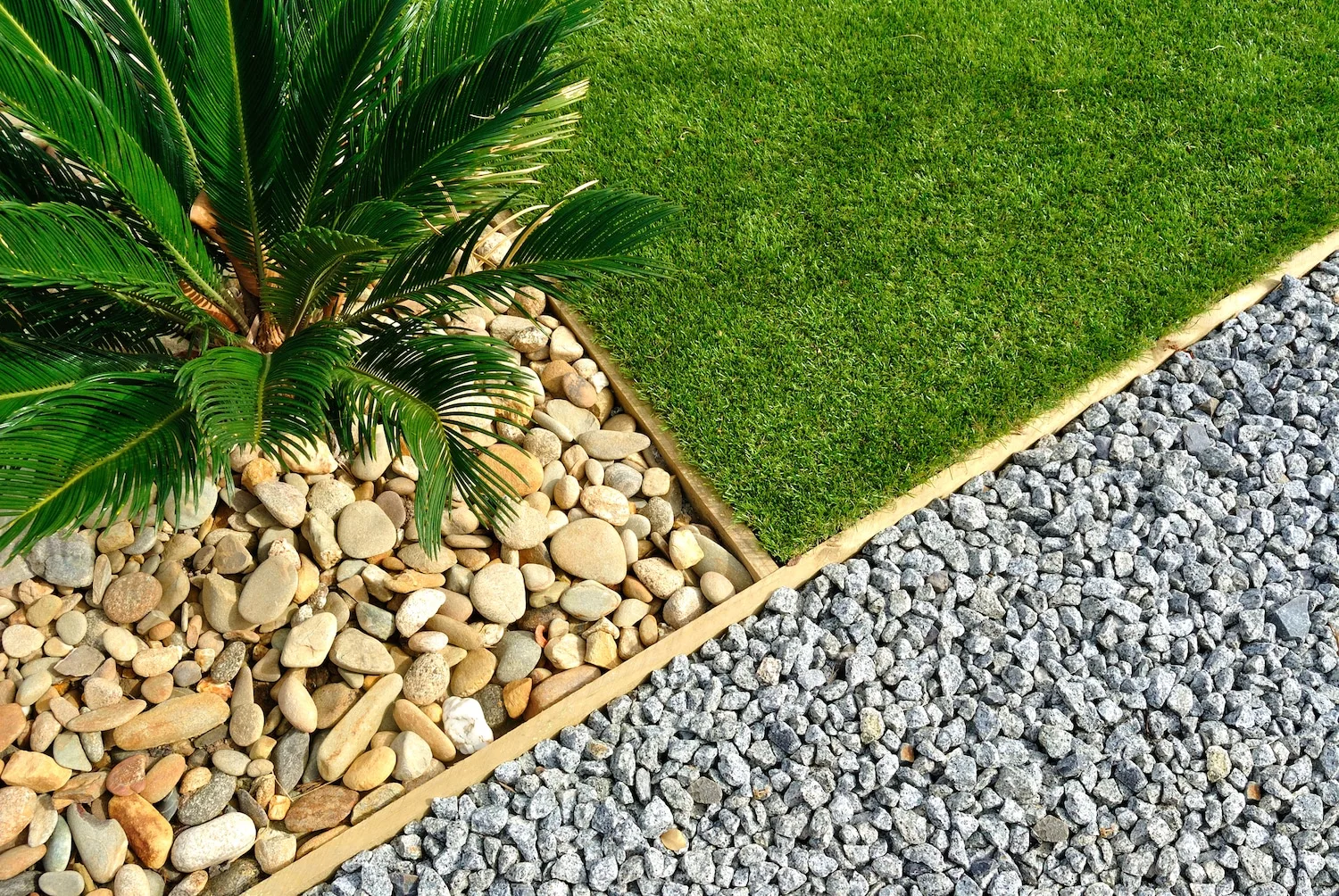 Close-up of turf and rock garden edging as part of a landscape design